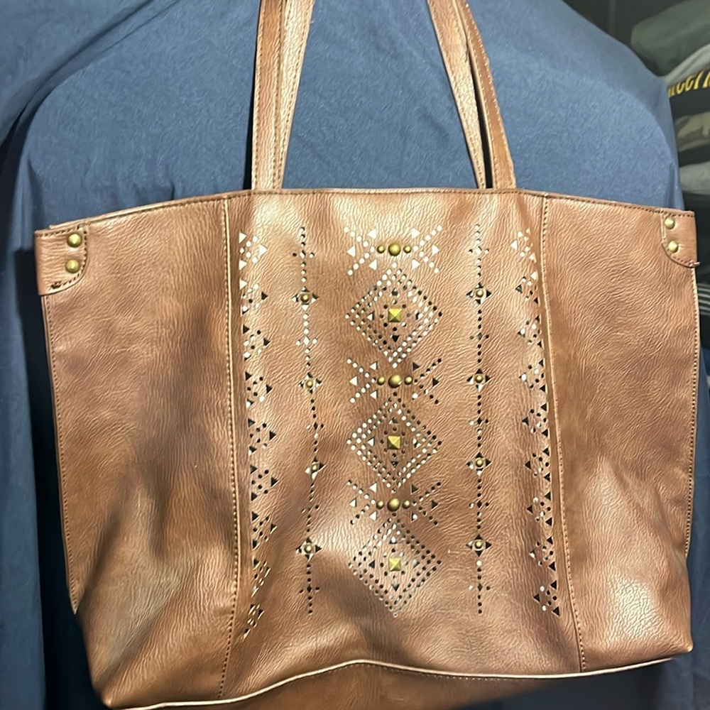 Lucky Brand brown studded purse with cutouts and Teal & horseshoe print lining.